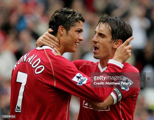 Cristiano Ronaldo of Manchester United celebrates Ole Gunnar Solskjaer scoring the first goal with team mate Gary Neville during the Barclays...