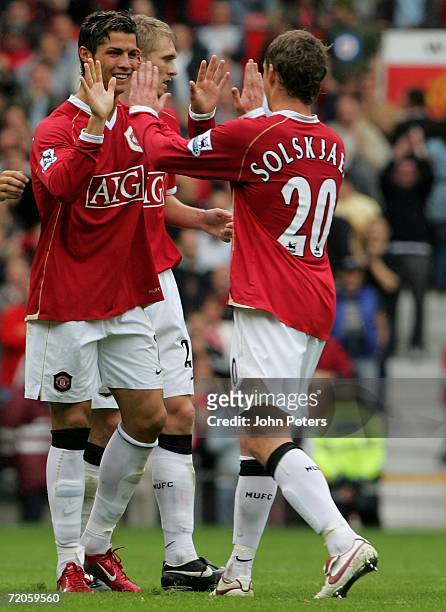 Cristiano Ronaldo of Manchester United celebrates Ole Gunnar Solskjaer scoring the first goal during the Barclays Premiership match between...