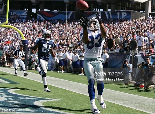 Terry Glenn of the Dallas Cowboys makes a catch for a touchdown in front of Chris Hope the Tennessee Titans during the first quarter on October 1,...