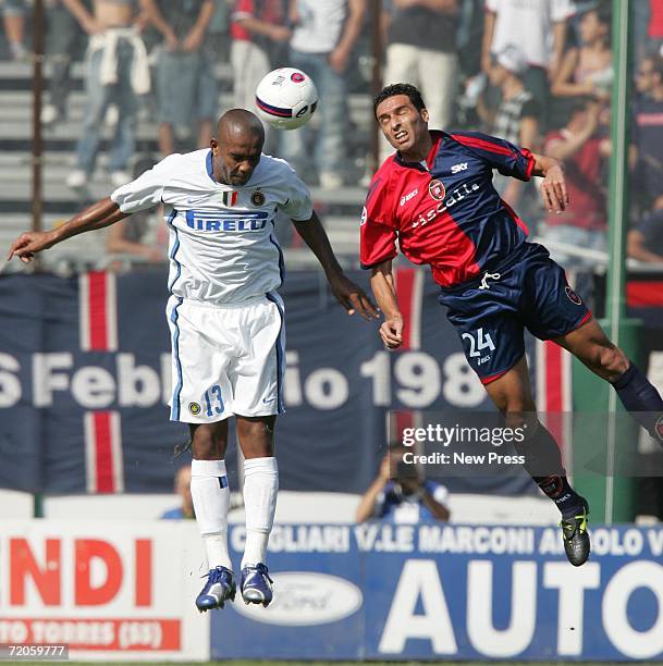 Sisenando Maicon of Inter goes for the ball with Antonino D'Agostino of Cagliari during the Italian Serie A match between Cagliari and Inter Milan at...