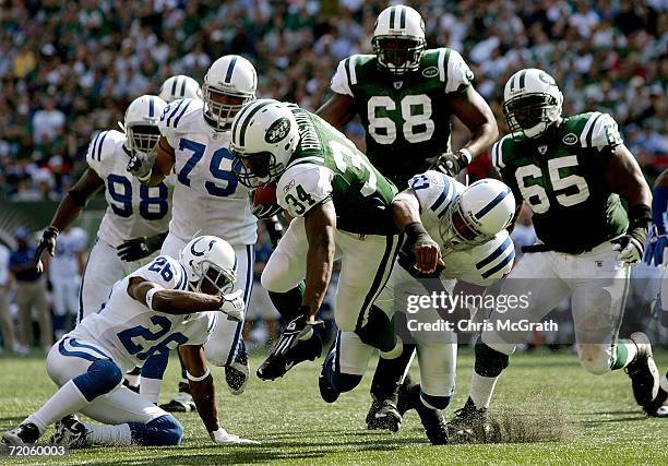 Running back Cedric Houston of the New York Jets tries to break through the Indianapolis Colts defense in the third quarter of the game on October 1,...