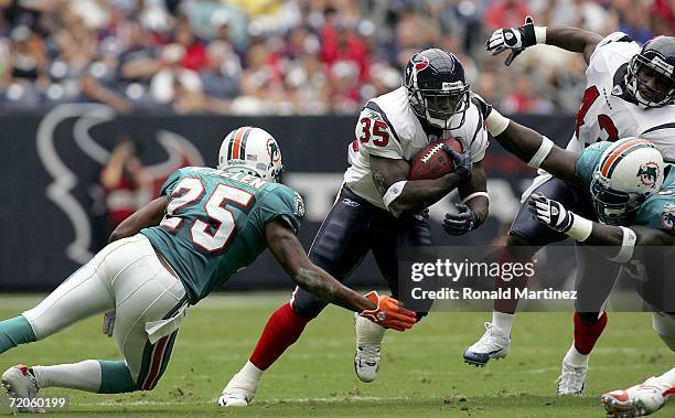 Running back Samkon Gado of the Houston Texans runs past Will Allen of the Miami Dolphins at Reliant Stadium on October 1, 2006 in Houston, Texas....