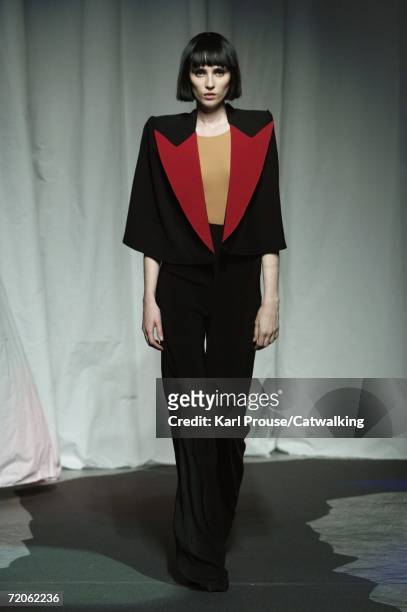 Model walks down the catwalk during the Maison Martin Margiela Fashion Show as part of Paris Fashion Week Spring/Summer 2007 on October 1, 2006 in...