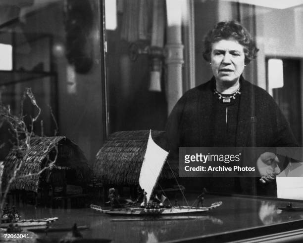 American cultural anthropologist Margaret Mead with a model of a New Guinean Manus village during the making of the documentary film 'New Lives For...