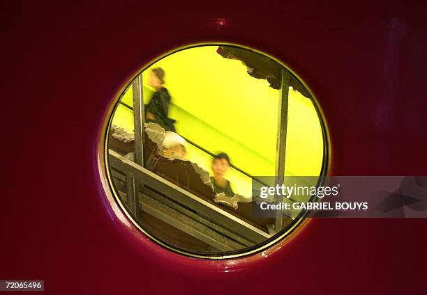 Seattle, UNITED STATES: People are seen using an escalator in the Seattle Public Library 30 September 2006 in Seattle, Washington. The unorthodox...