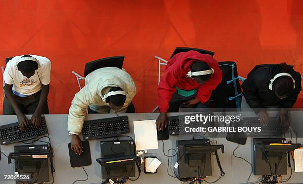 Seattle, UNITED STATES: People work on computers in the main hall at the new Seattle Public Library 30 September 2006 in Seattle, Washington. The...