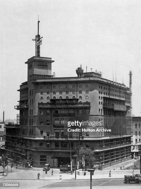 The head office of Asahi Shimbun News, near Ginza in Tokyo, circa 1925. Designed by architect Kikuji Ishimoto the building was originally painted...