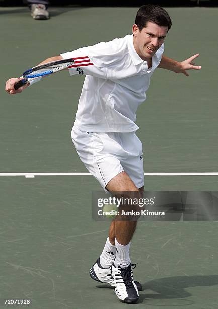 Tim Henman of Great Britain returns the ball against Frank Dancevic of Canada during the AIG Japan Open Tennis Championship 2006 on October 3, 2006...