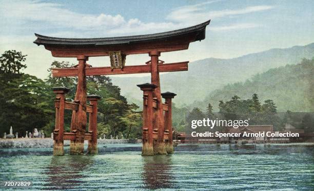 The torii of Itsukushima Shrine off Itsukushima Island, Japan, circa 1930.