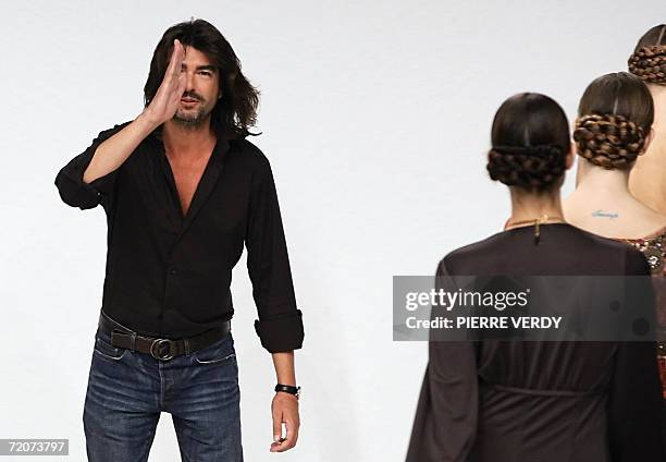 French designer Stephane Rolland acknowledges the public at the end of the Spring/Summer 2007 ready-to-wear collection show for Jean-Louis Scherrer...