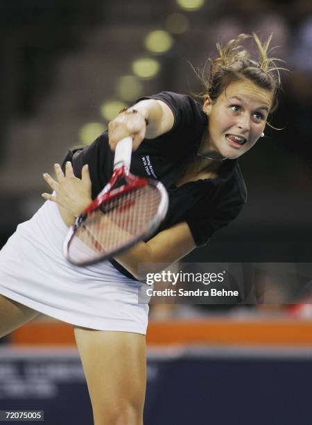 Tatjana Malek of Germany serves to Anna-Lena Groenefeld of Germany during the Porsche Tennis Grand Prix at the Porsche Arena on October 3, 2006 in...