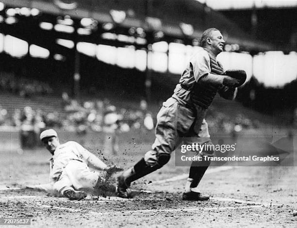 Gabby Hartnett, catcher for the Chicago Cubs, helps his team win the National League pennant with a putout during the victory over the St. Louis...