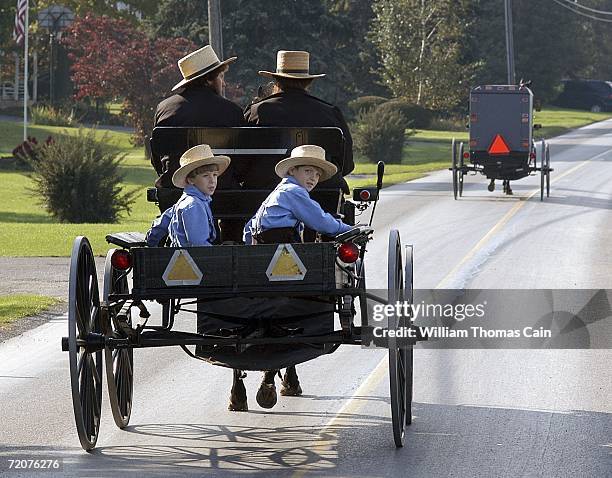Group of Amish children ride in a buggy near the one room Amish school house where five girls were murdered October 3, 2006 in Nickel Mines,...