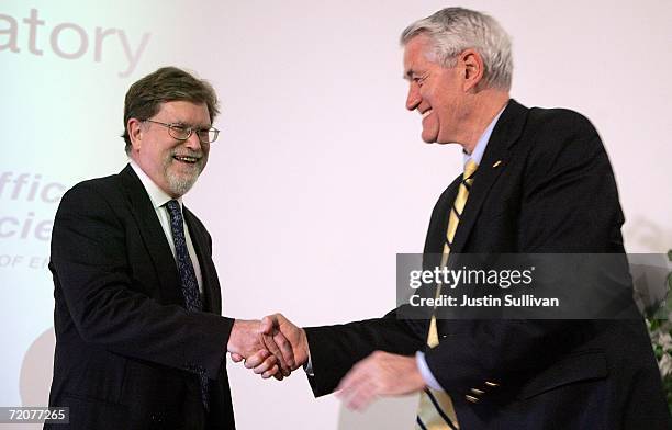 Berkeley astrophysicist professor George Smoot shakes hands with UC Berkeley Chancellor Robert J. Birgeneau during a press conference announcing his...