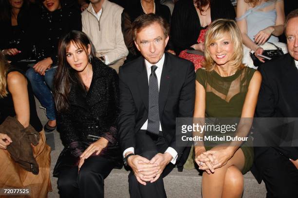 Monica Bellucci , Bernard Arnaut and Helene Arnaut attend the Christian Dior Fashion Show, as part of Paris Fashion Week Spring/Summer 2007 on...