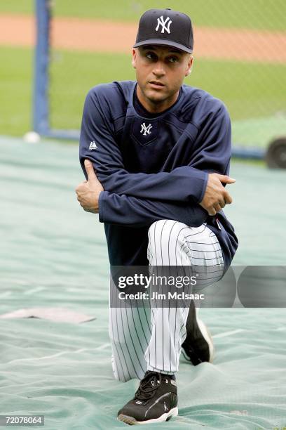 Derek Jeter of the New York Yankees stretches during batting practice prior to the start of game one of the American League Division Series against...