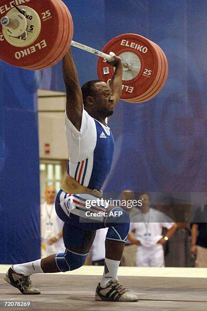 Santo Domingo, DOMINICAN REPUBLIC: French weightlifter Vencelas Dabaya performs 01 October, 2006 during the World Weightlifting Championship in Santo...