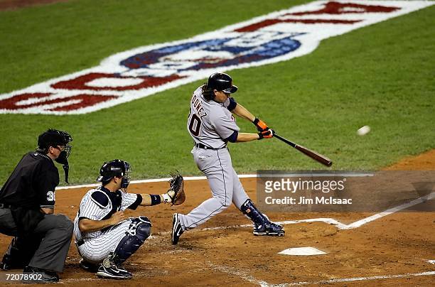 Magglio Ordonez of the Detroit Tigers hits a double to lead off the second inning against the New York Yankees in Game One of the American League...