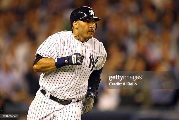 Gary Sheffield of the New York Yankees runs after hitting a single to drive in a run in the third inning against the Detroit Tigers in Game One of...