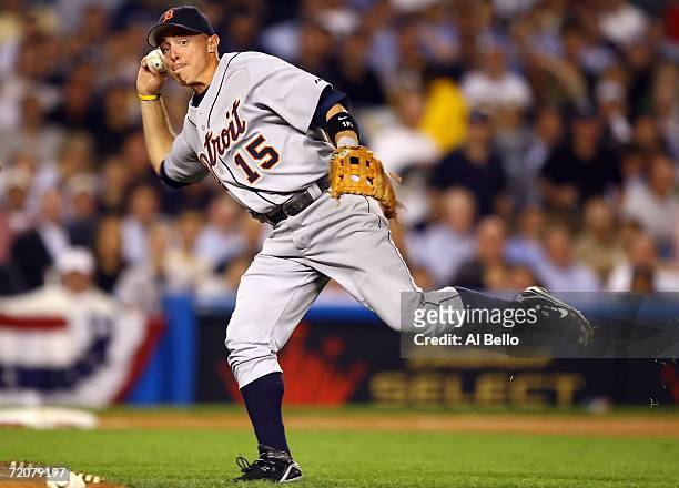 Brandon Inge of the Detroit Tigers throws out Robinson Cano of the New York Yankees in the sixth inning of Game One of the American League Division...