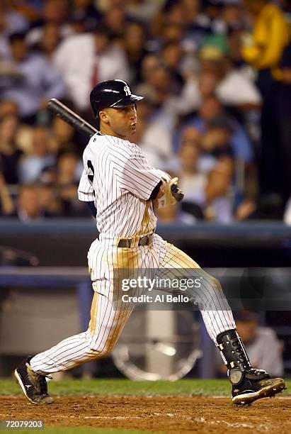 Shortstop Derek Jeter of the New York Yankees singles in the fourth inning of Game One of the American League Division Series against the Detroit...