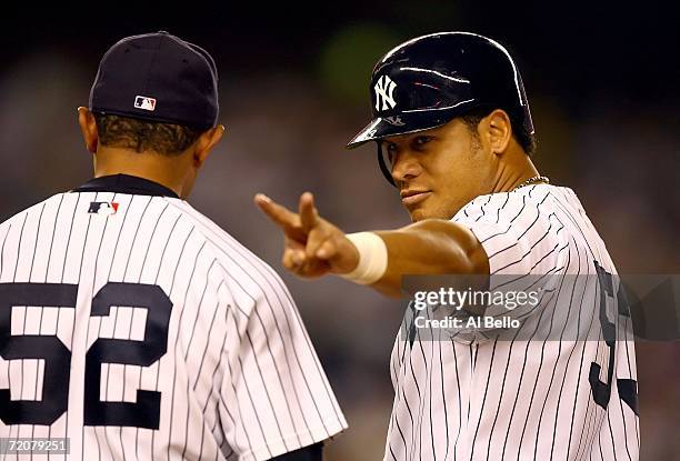 Bobby Abreu of the New York Yankees acknowledges the fans after hitting a single driving in a run in the sixth inning of Game One of the American...