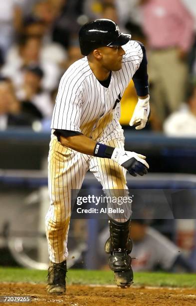 Shortstop Derek Jeter of the New York Yankees goes four for four by hitting a double in the sixth inning of Game One of the American League Division...