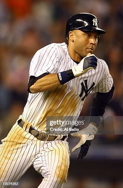 Shortstop Derek Jeter of the New York Yankees runs the bases after hitting a home run to go 5 for 5 in the eighth inning of Game One of the American...