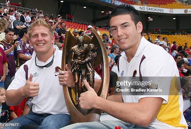 Ben Hennant and Darius Boyd of the Broncos give the thumbs-up as the Brisbane Broncos celebrate their NRL Grand Final win during a Grand Final parade...