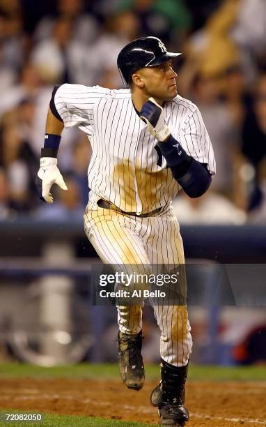 Shortstop Derek Jeter of the New York Yankees runs after his home run to tie the post season record for hits by going 5 for 5 in the eighth inning of...