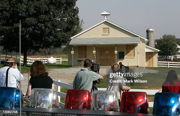 Members of the media get their first close up look in the daytime of the one room Amish school house where the shooting took place two days prior,...