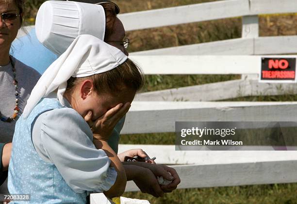 Amelia Yoder, who is from an Amish community in Michigan and was in town for a wedding grieves while visiting the one room Amish school house where...