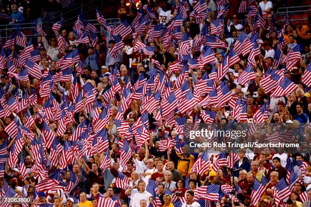 Washington Redskins fans wave their American Flags before the game against the Minnesota Vikings on September 11, 2006 at FedExField in Landover,...