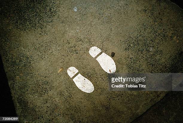 shoe print on street corner - stencil stock pictures, royalty-free photos & images