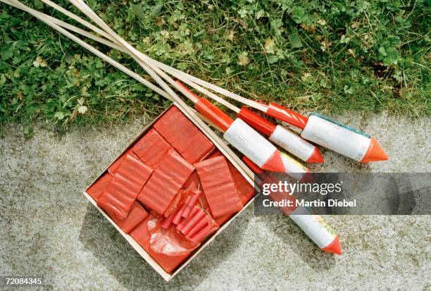 bottle rockets and fireworks on ground - firework rocket stock pictures, royalty-free photos & images