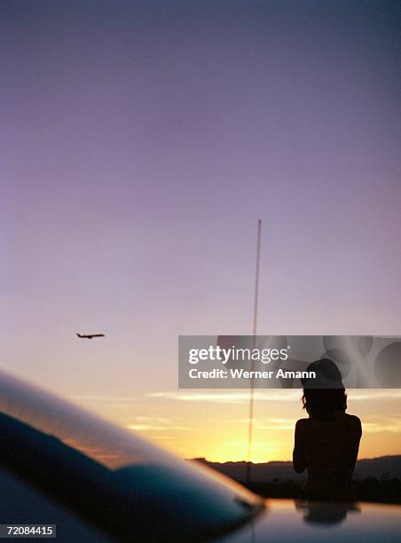 woman standing on roadside next to car - next to stock pictures, royalty-free photos & images
