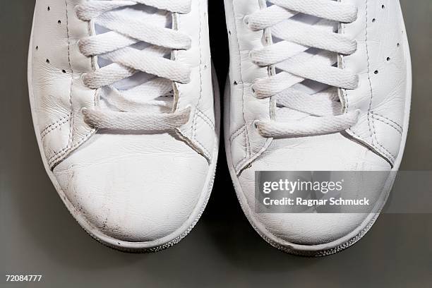 close-up of white sports shoes - white shoelace stock pictures, royalty-free photos & images