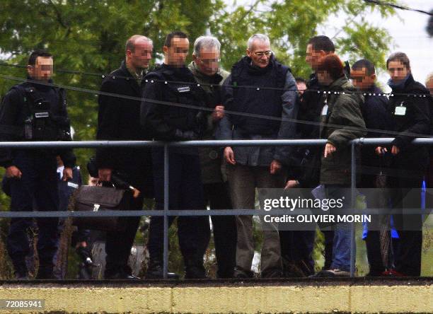 Montigny-les-Metz, FRANCE: Convicted serial killer Francis Heaulme is pictured next to Metz state prosecutor Joel Guitton during a reenactment, 03...