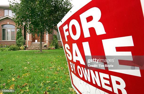 For Sale By Owner" sign is posted in front of an existing single-family residence for sale October 4, 2006 in Park Ridge, Illinois. The slowing of...