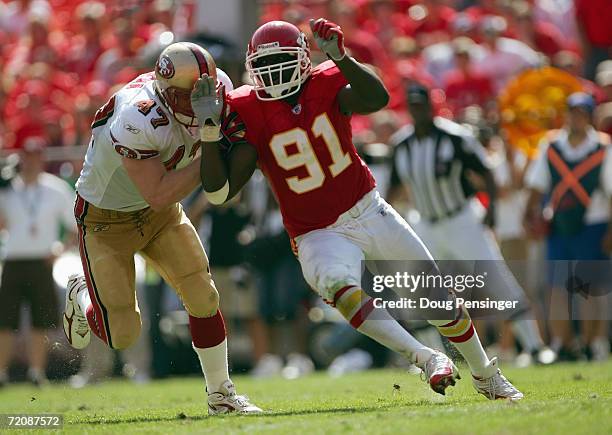 Defensive end Tamba Hali of the Kansas City Chiefs rushes against tight end Billy Bajema of the San Francisco 49ers at Arrowhead Stadium on October...