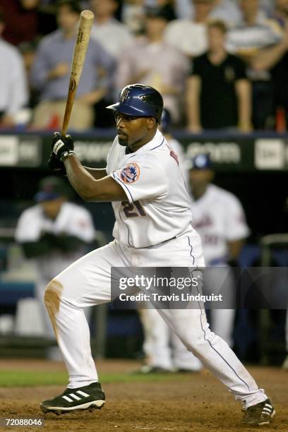 Carlos Delgado of the New York Mets bats against the Los Angeles Dodgers during game one of the National League Division Series at Shea Stadium on...