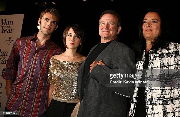 Jared Silver, Zelda Williams, actor Robin Williams and wife Marsha Garces Williams arrive at the premiere of Universal Pictures "Man of the Year" at...