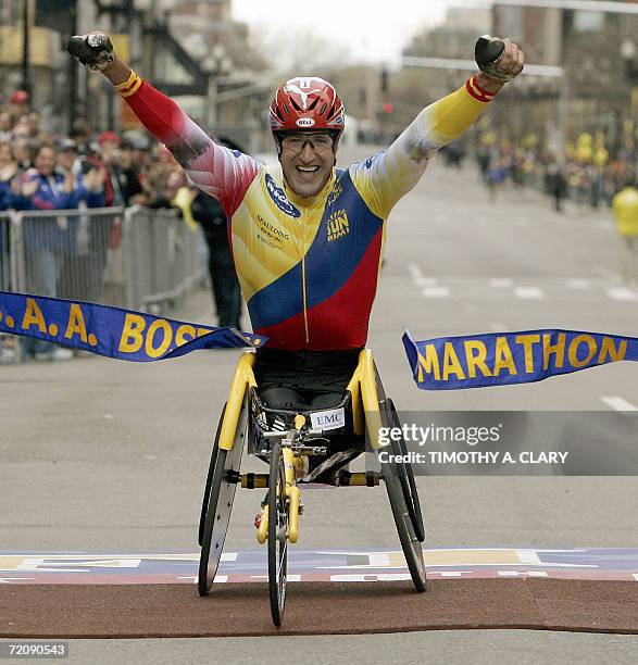 Boston, UNITED STATES: Ernst Van Dyk of South Africa crosses the finish line to win the men's wheelchair division of the 110th Boston Marathon 17...