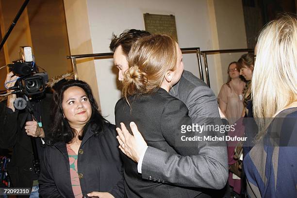 Designer Stella McCartney hugs her husband Alasdhair Willis the Stella McCartney Fashion Show, as part of Paris Fashion Week Spring/Summer 2007 on...