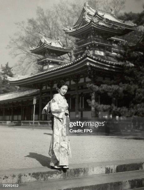 Japanese geisha in a kimono, circa 1935.