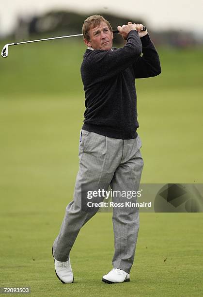 Kenny Dalglish plays his second shot on the par four 15th hole during the first round of the Alfred Dunhill Links Championship at The Carnoustie...