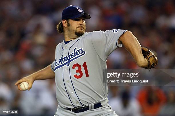 Brad Penny of the Los Angeles Dodgers pitches against the New York Mets during game one of the National League Division Series at Shea Stadium on...