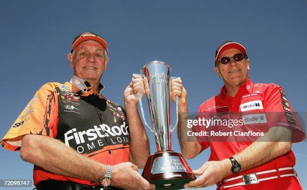 Former Ford V8 driver and rival of Peter Brock Dick Johnson holds the Peter Brock Trophy with Brock's former teammate Jim Richrads after the practice...