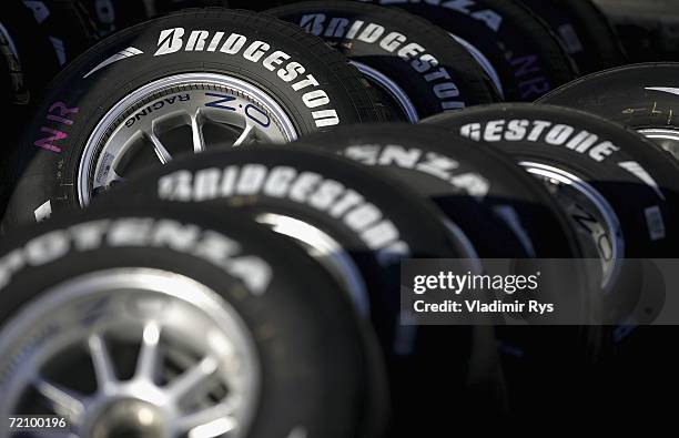 Bridgestone tyres are seen lined up in the paddock after the second practice session for the Japanese Formula One Grand Prix at the Suzuka Circuit on...