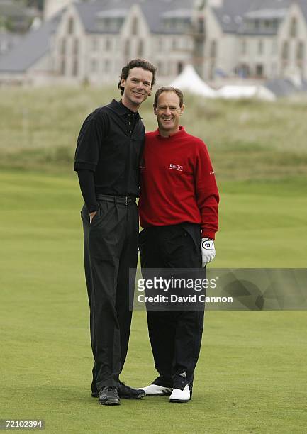 Mark Roe of England poses with his amateur playing partner William Paul Getty of the USA on the 2nd hole during the second round of the Alfred...